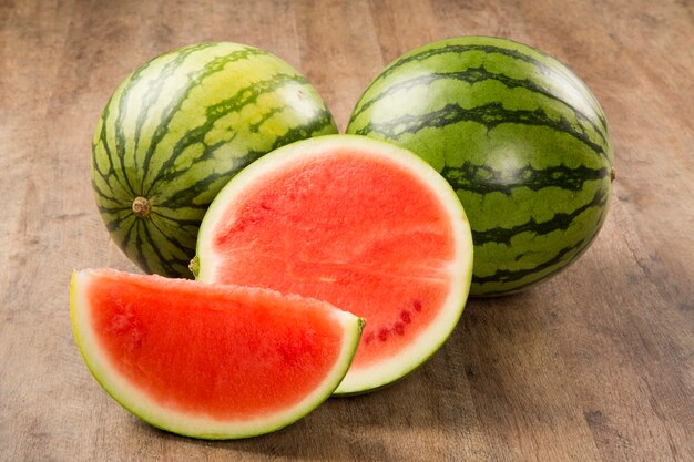 slices of watermelon on wooden table. Fresh fruits