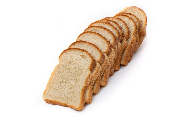 Slices of white bread or a loaf with sesame seeds isolated on a white background.