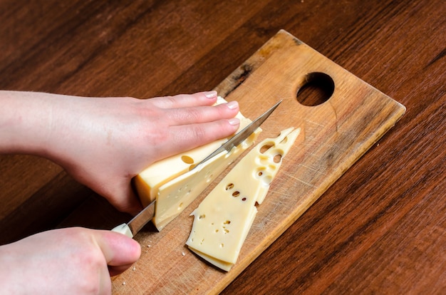 Slicing cheese on the Board