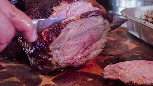 Slicing fresh out of the oven lamb roast.