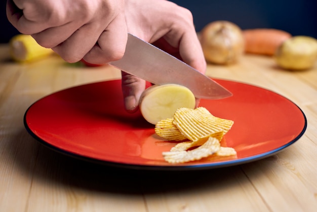 Slicing potatoes into chips