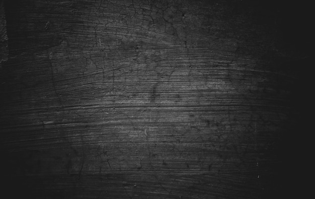 Slightly light black concrete cement texture for background Dark grunge distressed with scratches Scary dark walls overlay