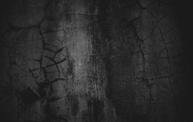 Photo slightly light black concrete cement texture for background dark grunge distressed with scratches scary dark walls overlay