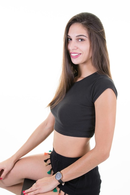 Slim sport young woman in black clothes over white background