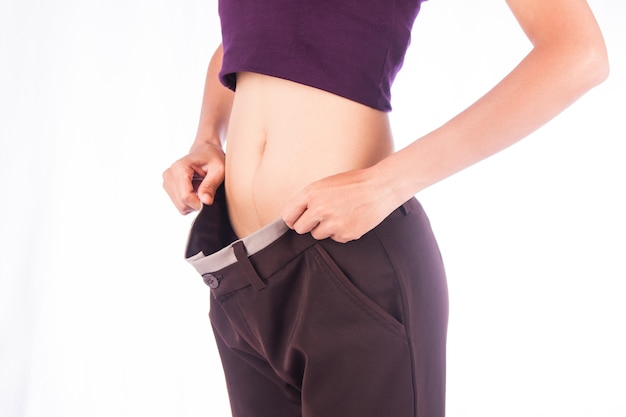 Slim waist of beauty woman in big trousers,after weight loose