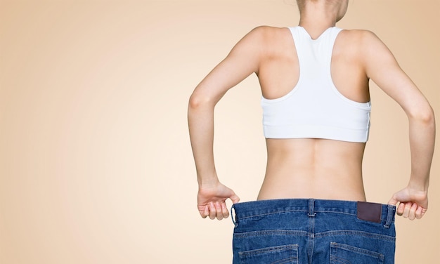 Slim  woman's body. Isolated over background.