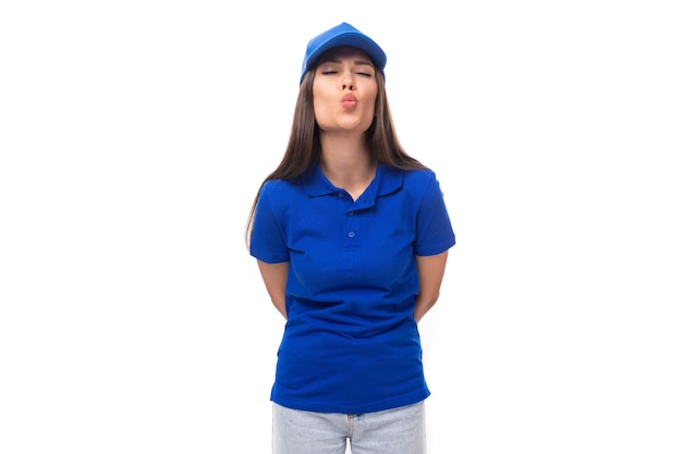 Slim young caucasian brunette woman in uniform tshirt and cap with space for printing on fabric