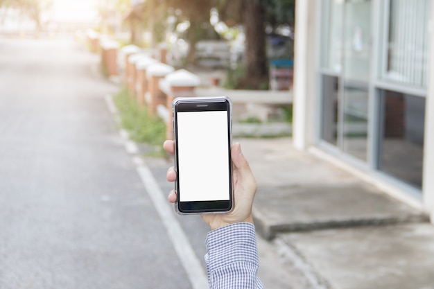 Slimme telefoon bij de hand, bespotten op het scherm