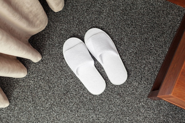 Slippers on the floor of hotel room