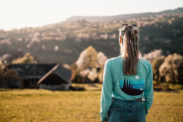 Slovakia mountain landscape Nature fields High Tatras Europe Belianske Tatry Happy woman on the sunset in nature in summer looking at camara