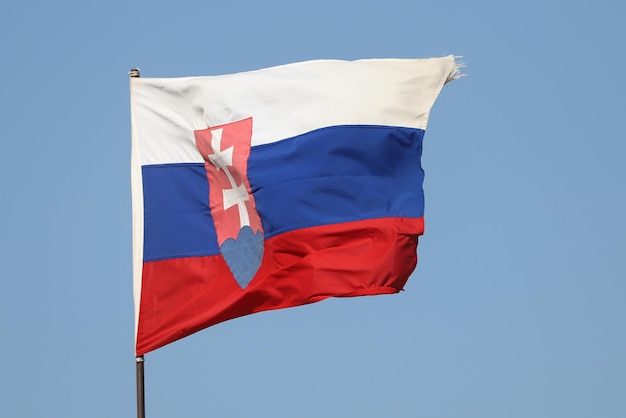 Slovakian flag flying on flagpole