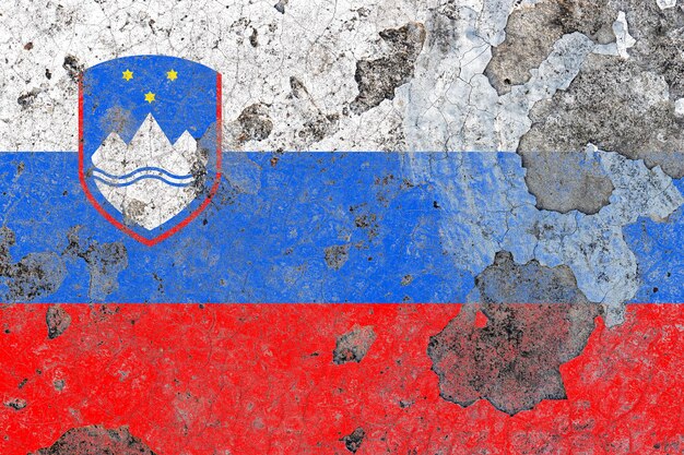 Slovenia flag on a damaged old concrete wall surface