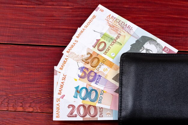 Slovenian money Tolar in the black wallet