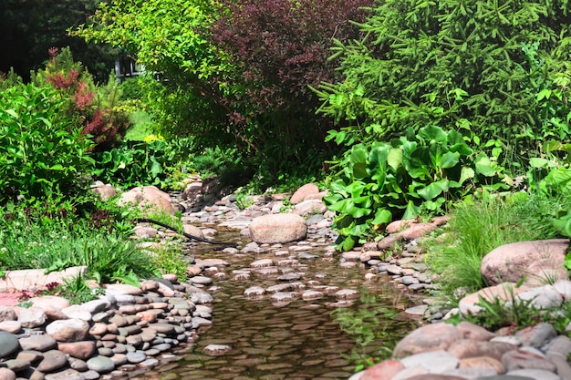 Slow trickle with large pink pebble