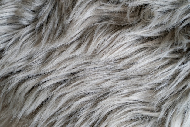 Sluit omhoog van een grijs schapehuiddeken, tapijtbont.