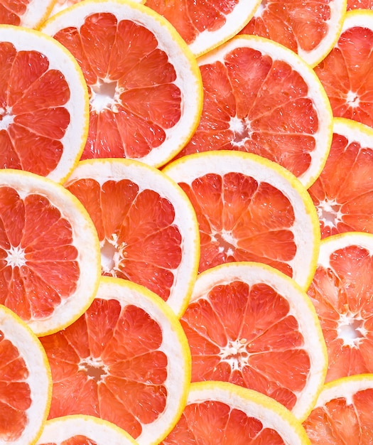 Sluit omhoog van gesneden grapefruit als achtergrond