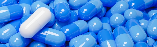 Sluit omhoog van witte pillencapsule in vele blauwe pillencapsules