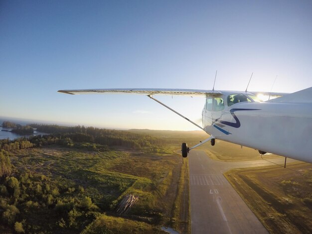 Small airplane taking off from the airport runway