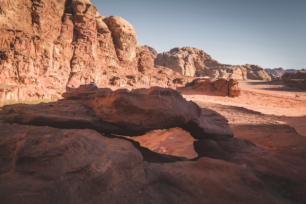 Small arch in the dry and hot desert of Wadi Rum Jordan