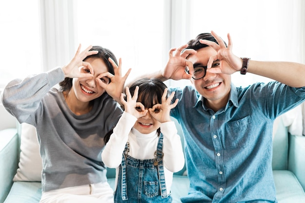 small asian family portrait at home