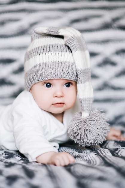 Premium Photo | Small baby boy lying on stomach and raising his head awhile looking surprised and smiling cute, newborn Premium Photo | Small baby boy lying on stomach and raising his head awhile looking surprised and smiling cute, newborn