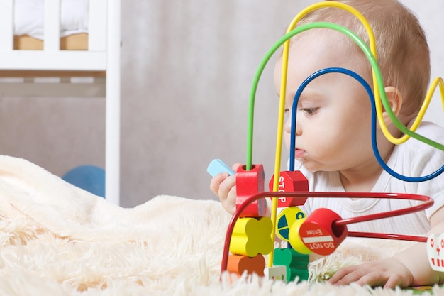 A small baby girl of eight months old is left  alone in her room