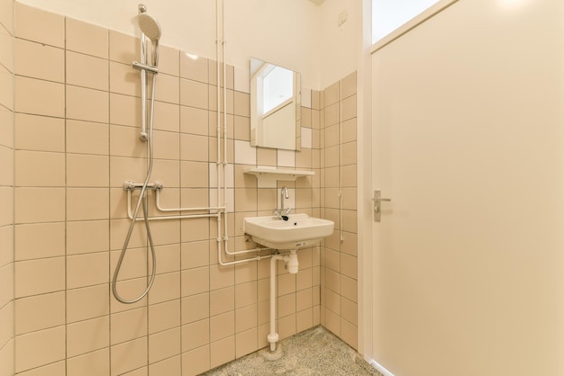 A small bathroom with a shower and a sink