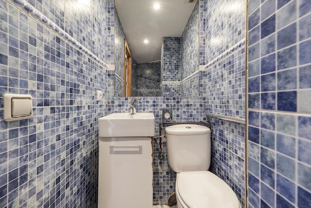 A small bathroom with a square porcelain