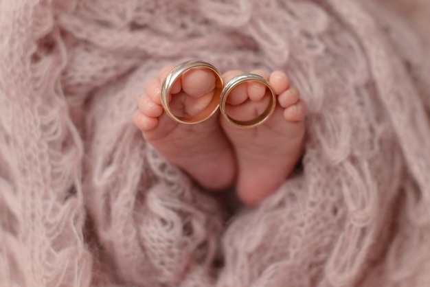 small beautiful legs of a newborn baby in the first days of life baby feet of a newborn