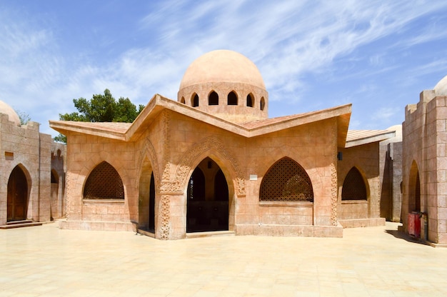 Small beautiful neat stone clay Arab Islamic Muslim houses with round domes in the desert