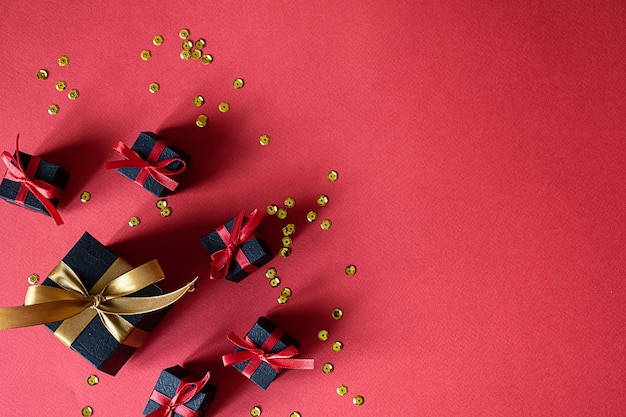 Small black gift box on red table