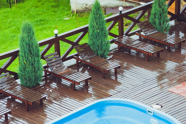 Small blue swimming pool near house