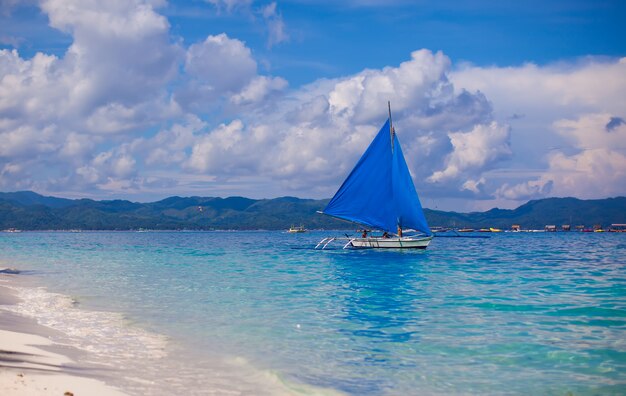 Small boat in open sea on the island of Boracay