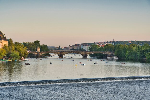 Small boats on the river Vltava in Prague