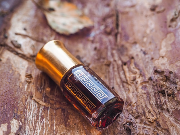 Premium Photo | Small bottle of agarwood oil