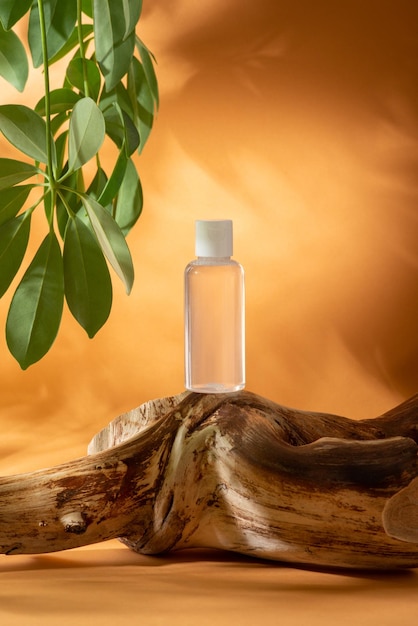 Small bottle of micellar water face tonic on orange background