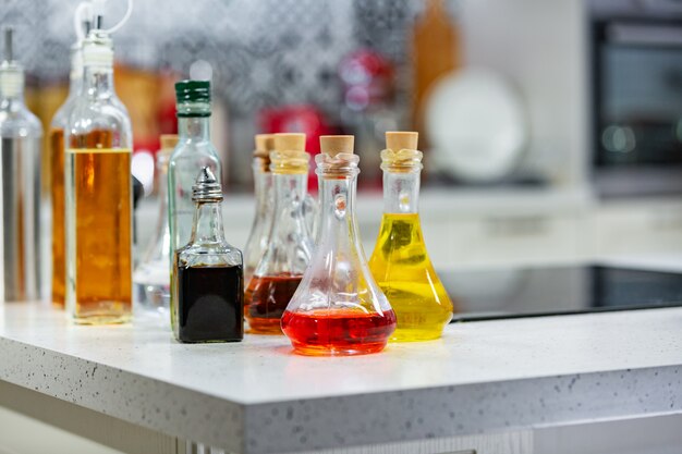 Small bottles of flavored olive oil and balsamic vinegar in the kitchen copy space