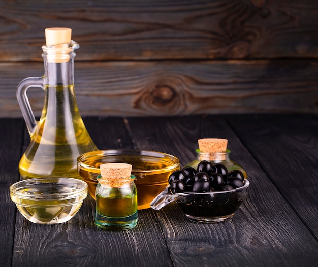 The small bowl and bottle with olive oil