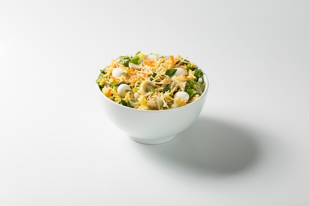 Small bowl of salad on white