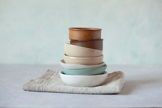Small bowls of natural colors on the light green background