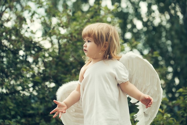 Small boy in angel wings