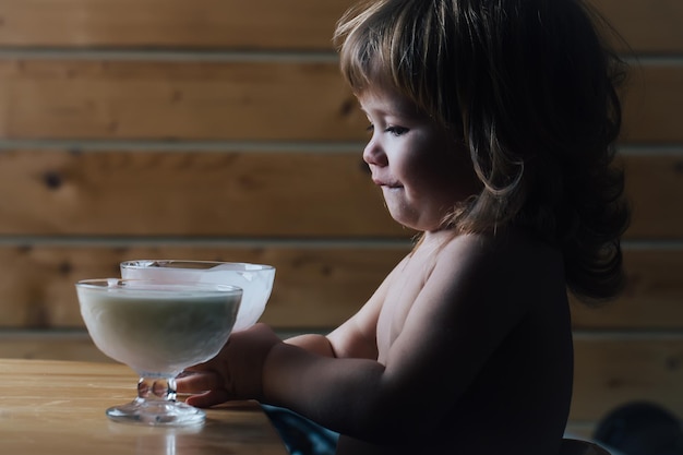 Small boy eating yoghurt