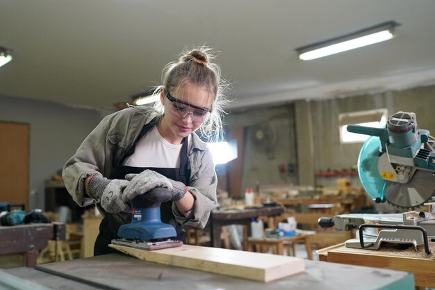 small business of a young woman in furniture workshop background