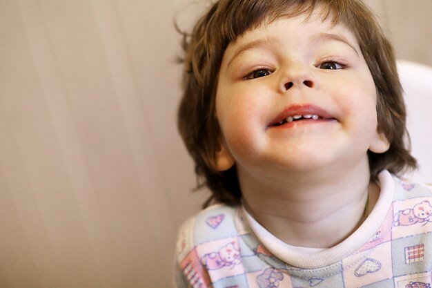 small caucasian kid smiling and have fun white background