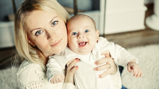 A small child in the arms of mom . positive human emotions, feel