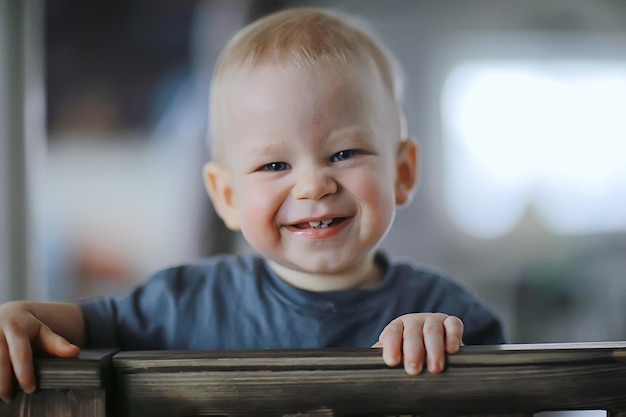 small child is laughing smiling a cheerful kid