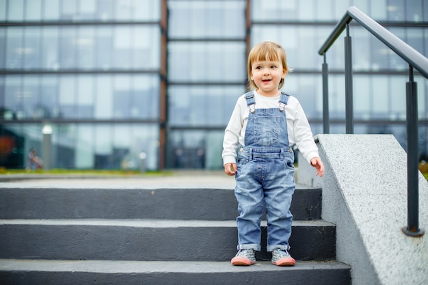 A small child on a walk in the city