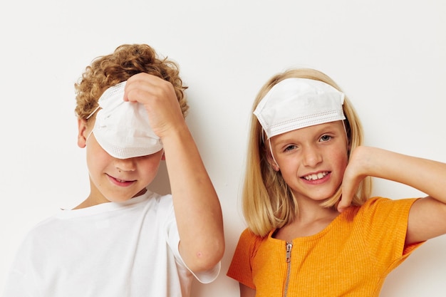 Small children in medical mask protection posing grimace lifestyle unaltered