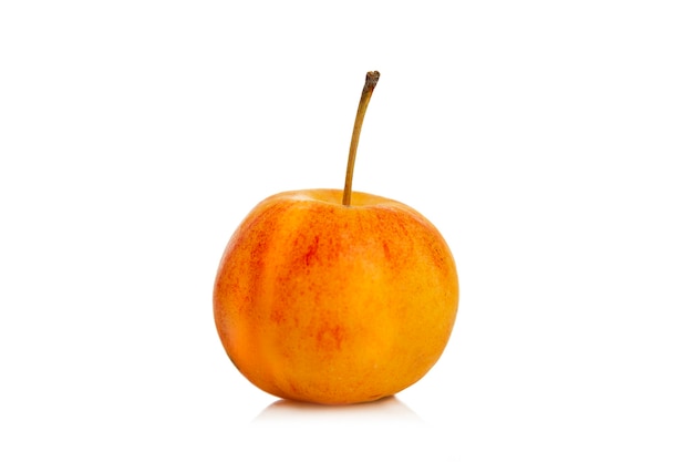 Small Chinese apple. A beautiful yellow-red fruit. Close-up. Vitamins from nature. Isolated on white background.