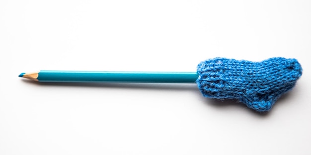 Photo small colorful knitted sock on a white background